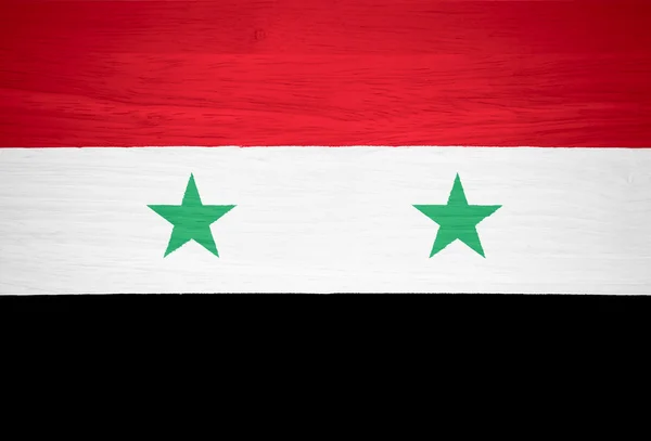 Bandera de Siria sobre textura de madera — Foto de Stock