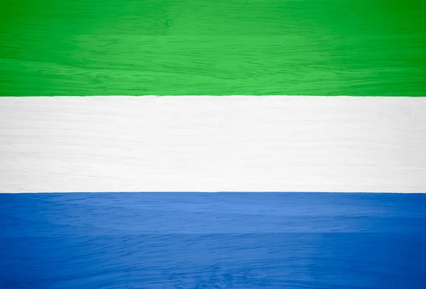 Sierra Leone flag on wood texture — Stock Photo, Image