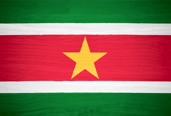 Suriname flag on wood texture — Stock Photo, Image