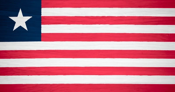 Liberia flag on wood texture — Stock Photo, Image
