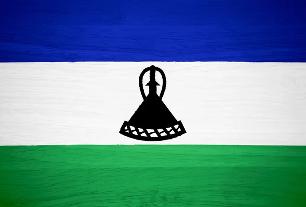 Lesotho flag on wood texture — Stock Photo, Image