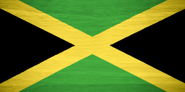 Jamaica flag on wood texture