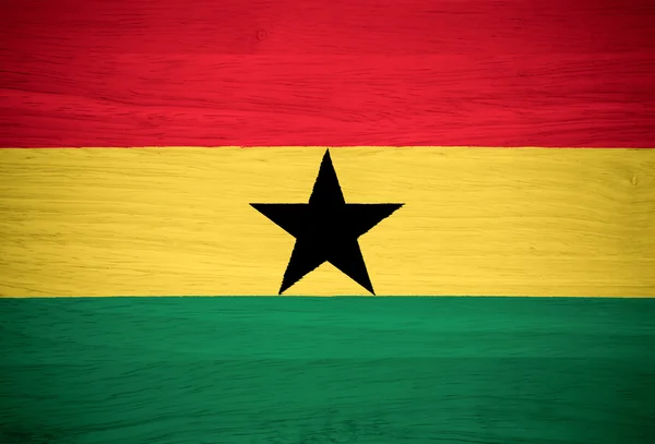 Ghana flagga på trä textur — Stockfoto