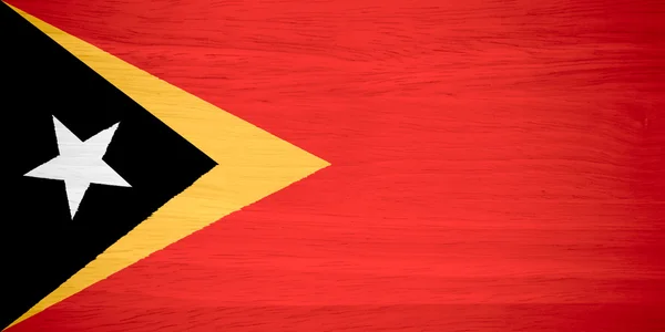 Bandeira de Timor-Leste sobre textura de madeira — Fotografia de Stock