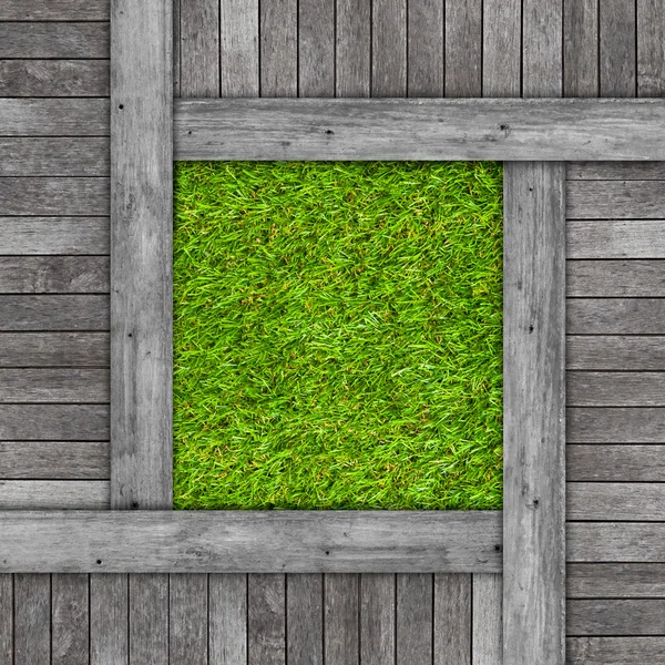 Wood texture on artificial grass background — Stock Photo, Image