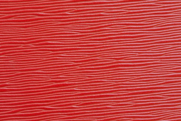 Placa de plástico vermelho fundo textura de madeira — Fotografia de Stock