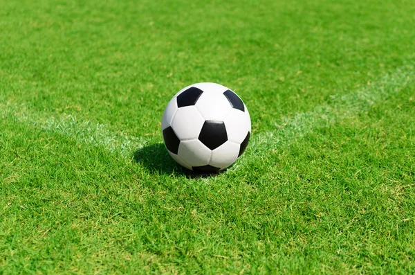 Soccer ball on soccer field — Stock Photo, Image