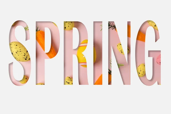 Słowo Spring Kształt Cięcia Białym Papierze Różnych Kolorowych Pisanek Koncepcja — Zdjęcie stockowe