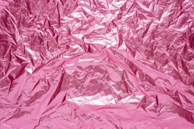 Soyut pembe buruşuk folyo arka plan. Asgari parti konsepti.