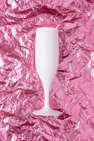 White Champagne Glass Pink Crumpled Foil Background Minimal Party Concept — Stock Fotó