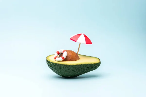 Summer Beach Concept Made Avocado Fruit Sun Umbrella Swimming Ring — Stockfoto