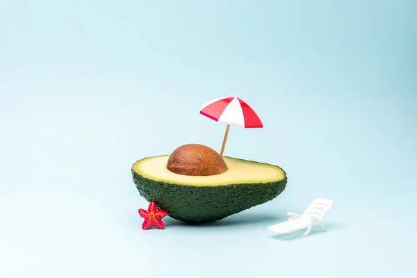 Summer Beach Background Made Avocado Fruit Sun Umbrella Sunbed Creative — Stockfoto