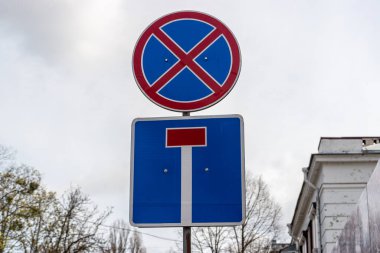 Street signs in the city against the sky.