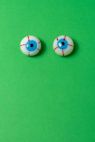 Bloody Eyeball Halloween Candies Vivid Green Background Spooky Minimal Concept — 图库照片