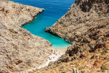 Aerial top view by drone of beach of Seitan Limania in bay with turquoise water and an unusual shape in Akrotiri, Crete. 