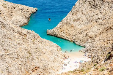 Aerial top view of beach of Seitan Limania in bay with turquoise water and an unusual shape in Akrotiri, Crete. 