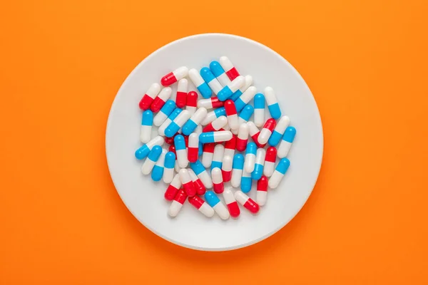 Colorful Pills White Plate Orange Background Minimal Concept — Φωτογραφία Αρχείου