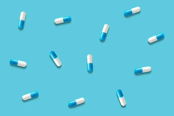 Top View Capsule Pills Blue Background Minimal Pharmacy Concept —  Fotos de Stock