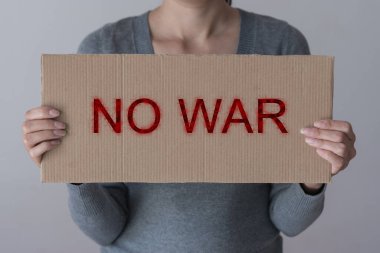 A woman holds sign 