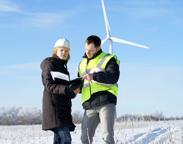 Team og engineers with wind turbines — Stock Photo, Image