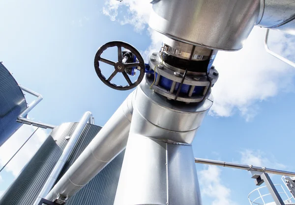 Equipment, cables and piping as found inside of a modern industr Stock Image