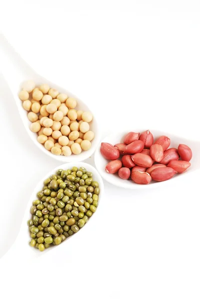 Cereal in spoon on a white background. — Stock Photo, Image