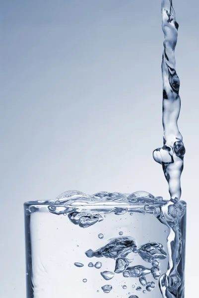 Water splash out of glass — Stock Photo, Image