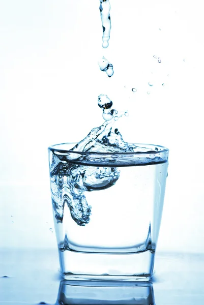 Salpicos de água do vidro — Fotografia de Stock