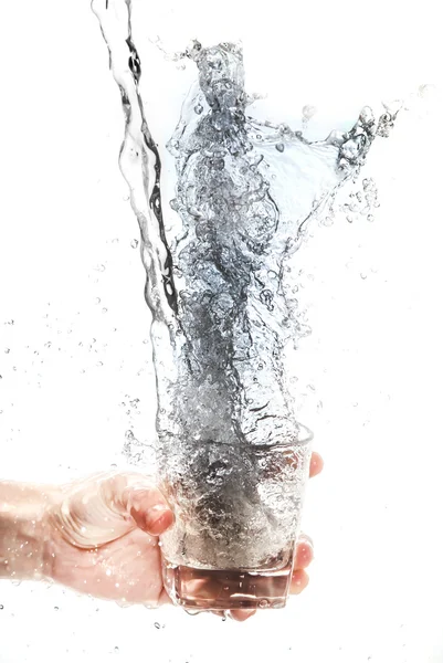 Holding cups, splashing water — Stock Photo, Image