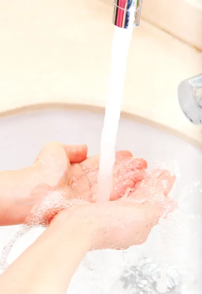 Hands covered with soap being washed in the sink — Stock Photo, Image