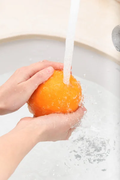 Fresh sweet orange under drops of water — Stock Photo, Image