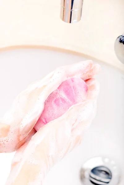 Hands covered with soap being washed in the sink — Stock Photo, Image