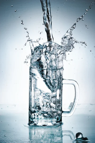 Water splash out of glass — Stock Photo, Image