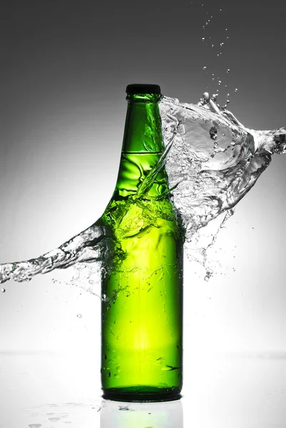 Beer bottle with water splash — Stock Photo, Image