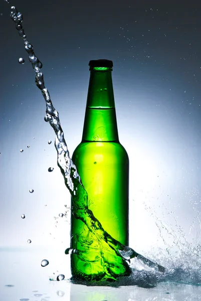 Beer bottle with water splash — Stock Photo, Image