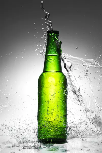 Beer bottle with water splash — Stock Photo, Image