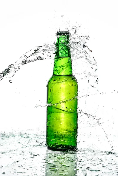 Beer bottle with water splash Royalty Free Stock Images