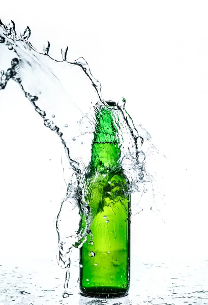 Beer bottle with water splash Stock Image