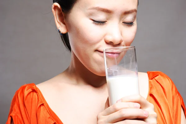 Young Woman with a glass of milk — Stock Photo, Image