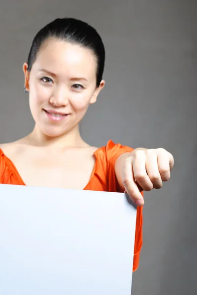 Beautiful business woman with a white banner. — Stock Photo, Image