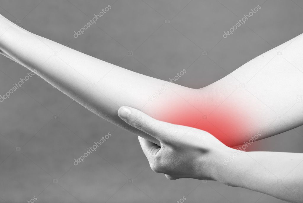 Acute pain in a woman wrist. Female holding hand to spot of wris