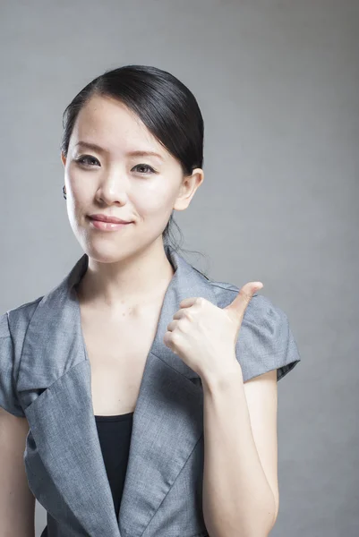 Portrait of a young beautiful woman with two thumbs up — Stock Photo, Image
