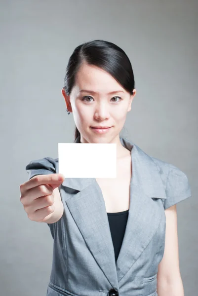 Beautiful business woman with a white banner. — Stock Photo, Image