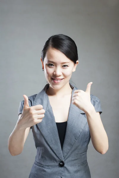 Portrait of a young beautiful woman with two thumbs up — Stock Photo, Image