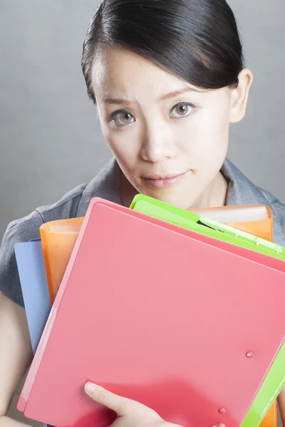 Bright picture of beautiful woman with folders — Stock Photo, Image