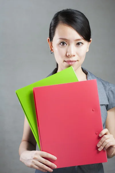 Bright picture of beautiful woman with folders — Stock Photo, Image