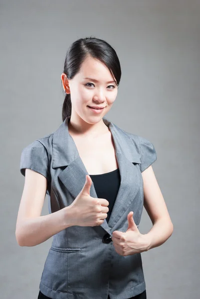 Portrait of a young beautiful woman with two thumbs up — Stock Photo, Image