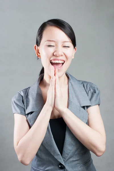 Happy Asian woman with her arms in the air cheering — Stock Photo, Image