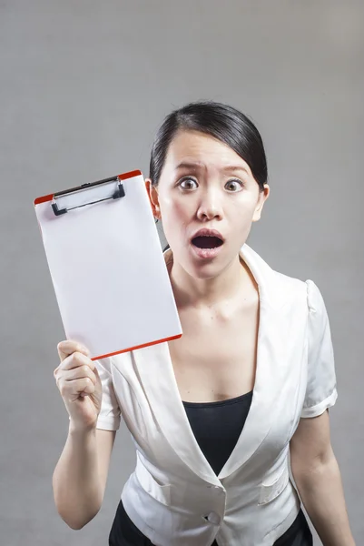 Beautiful business woman with a white banner. — Stock Photo, Image