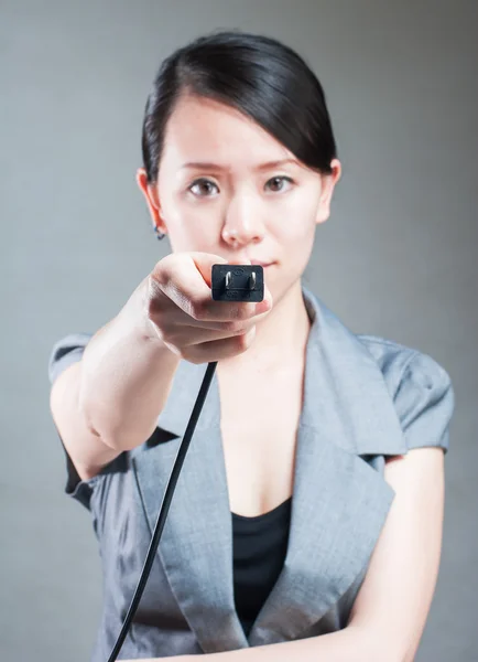 Woman with electricity cables. Plugged in concept. — Stock Photo, Image